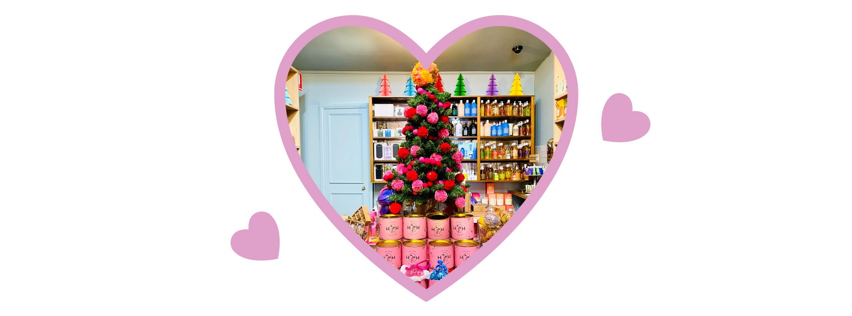 christmas tree and products at lore perfumery in a heart frame