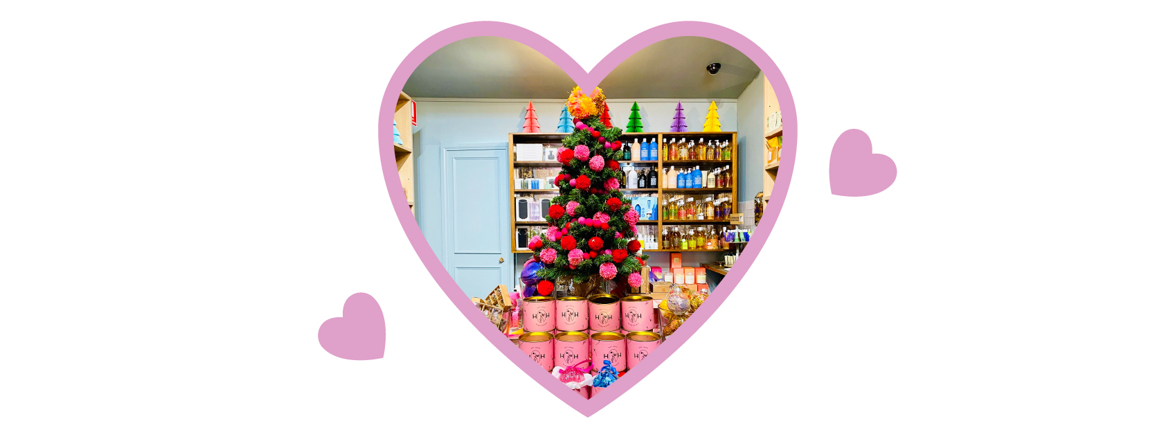 christmas tree and products at lore perfumery in a heart frame