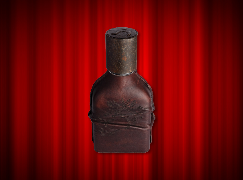 bottle of cuoium by orto parisi in front of red curtains
