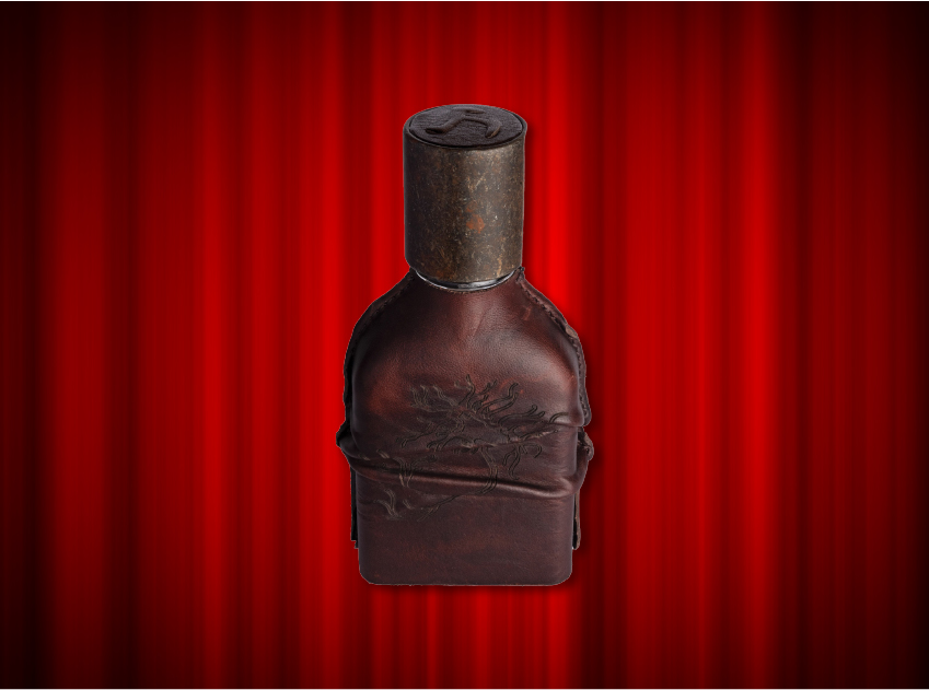 bottle of cuoium by orto parisi in front of red curtains