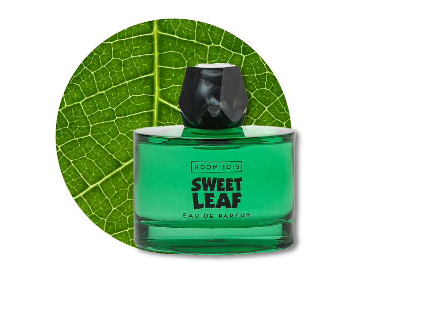 a bottle of sweet leaf perfume by room 1015 with a close-up photo of a leaf