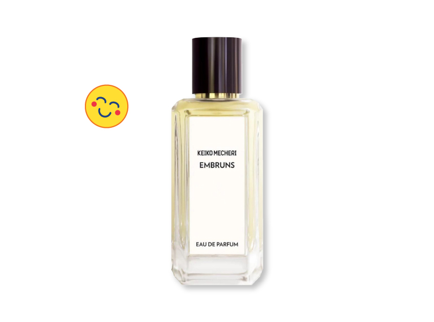 a bottle of embruns by keiko mecheri with a smiley face